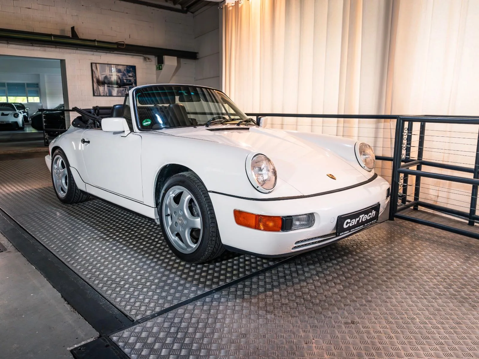 1990 Porsche 911 Carrera 4 Cabriolet 964 offered by a specialist dealer in Ismaning, Germany, main photo
