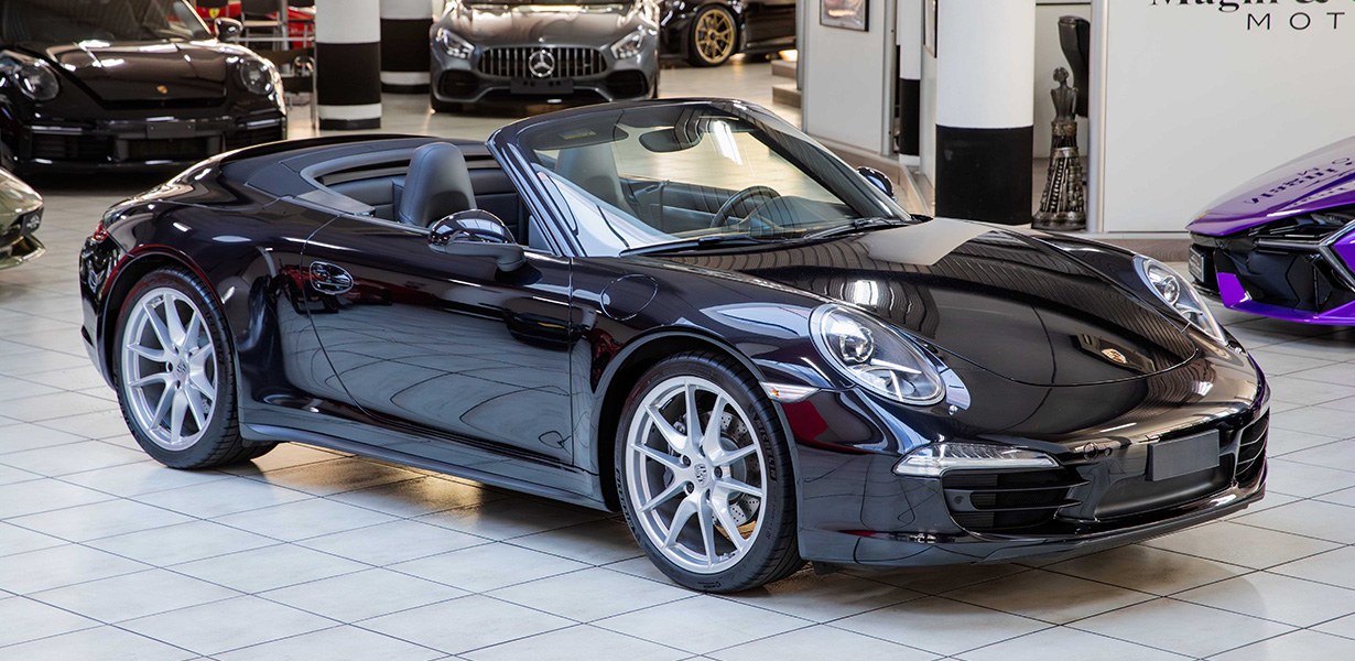 2015 Porsche 911 Carrera 4 Cabriolet proposée par un concessionnaire spécialisé à Milan, Italie, photo principale
